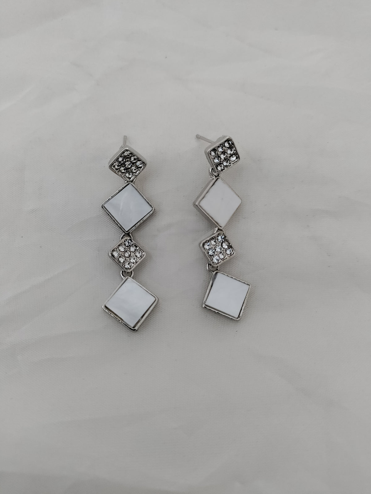 White and silver trendy earrings