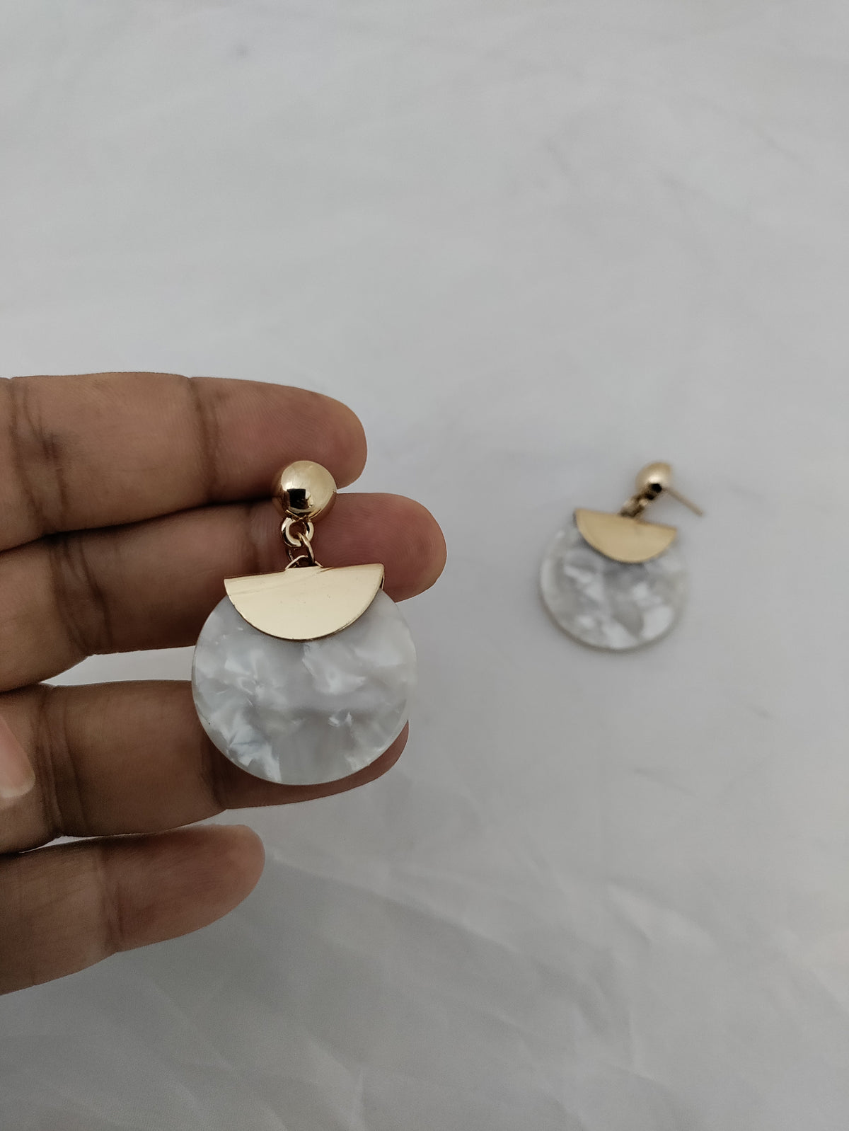 White and gold trendy earrings